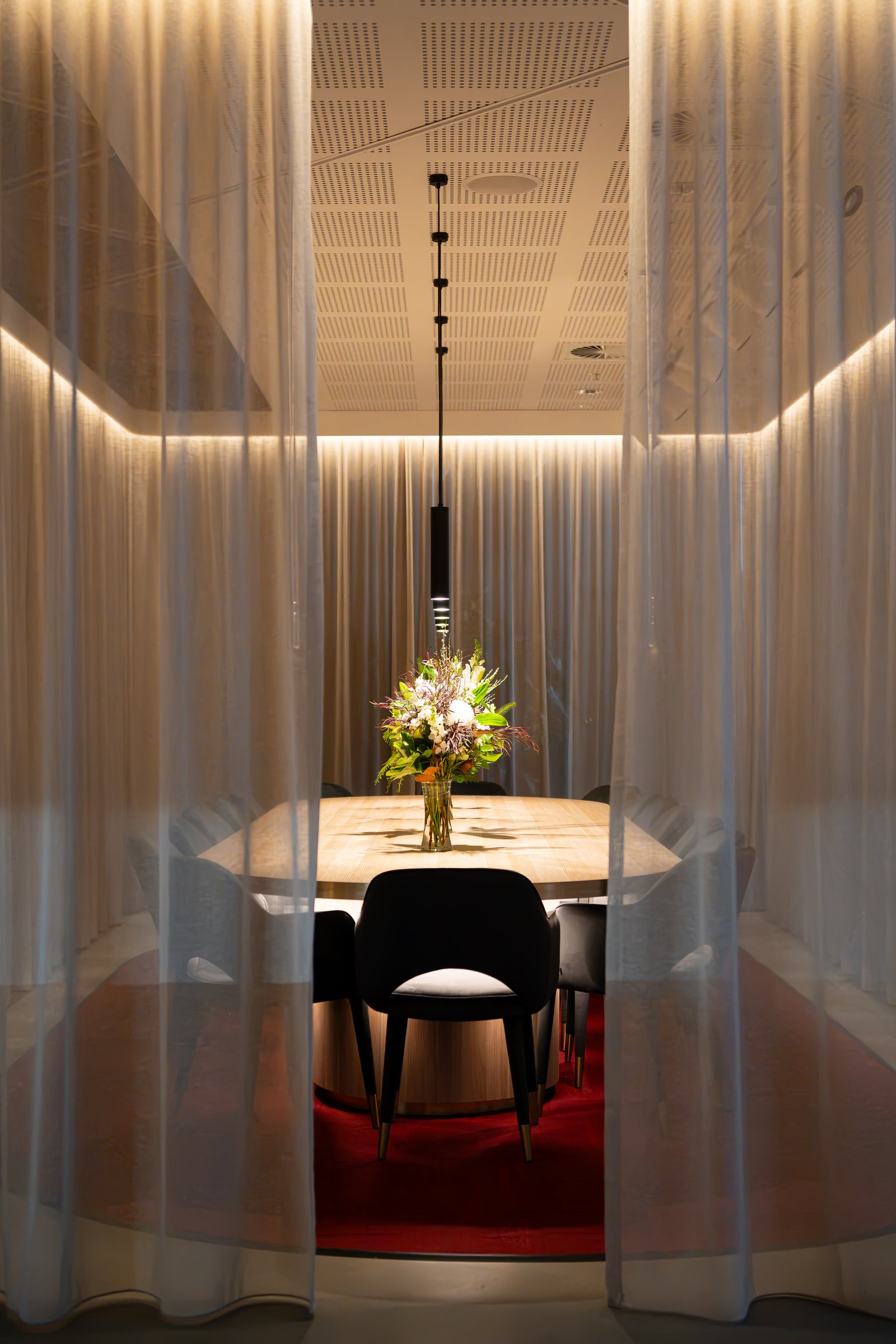 Private dining room at Cecilia, seen through sheer curtains